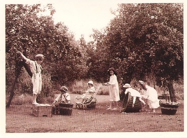 Featured is a postcard image depicting children busy at "pretend play".  The postcard is one of a series ... The Country Children Collection by Caroline Arber.  This and other original cards from the series are for sale in The unltd.com Store.